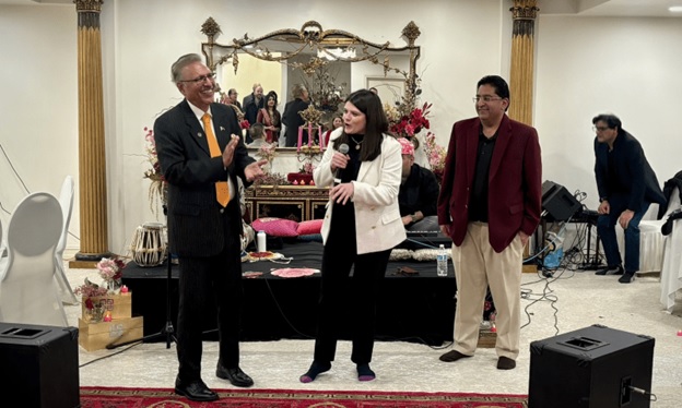 Former president Arif Alvi gestures as Rep Haley Stevens speaks during an event organised by the Southeast Michigan Pakistani community, over the weekend.—X / @RepHaleyStevens