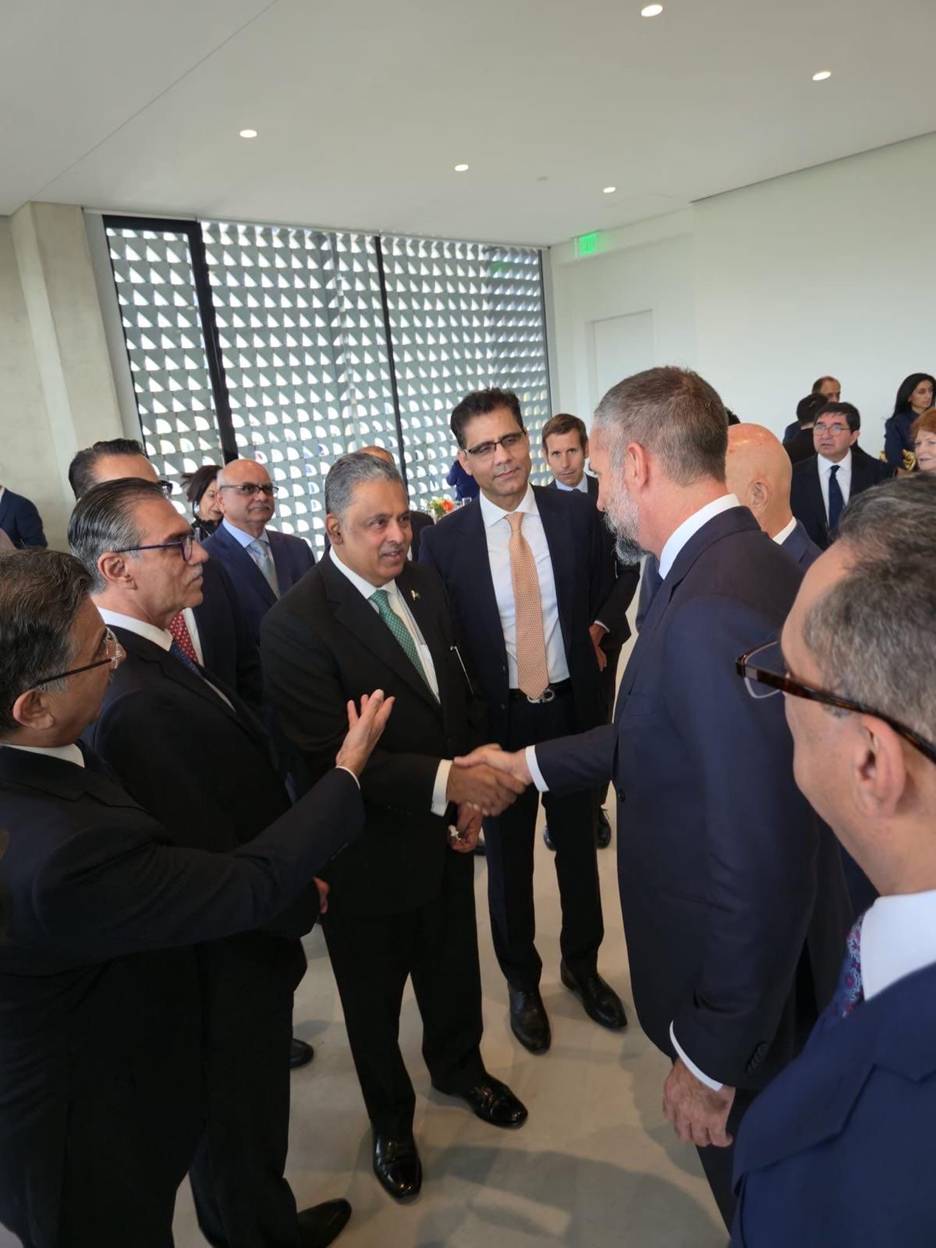 A group of men shaking hands AI-generated content may be incorrect.