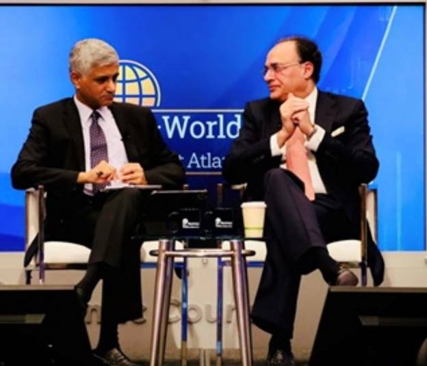 A person in suit sitting next to another person in suit  AI-generated content may be incorrect.