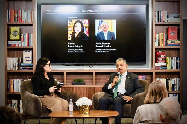 A person and person sitting in chairs in front of a large screen  AI-generated content may be incorrect.