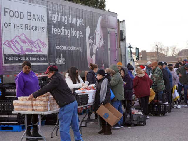 A group of people at an outdoor market  Description automatically generated with medium confidence