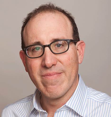 A person wearing glasses Description automatically generated with medium confidence