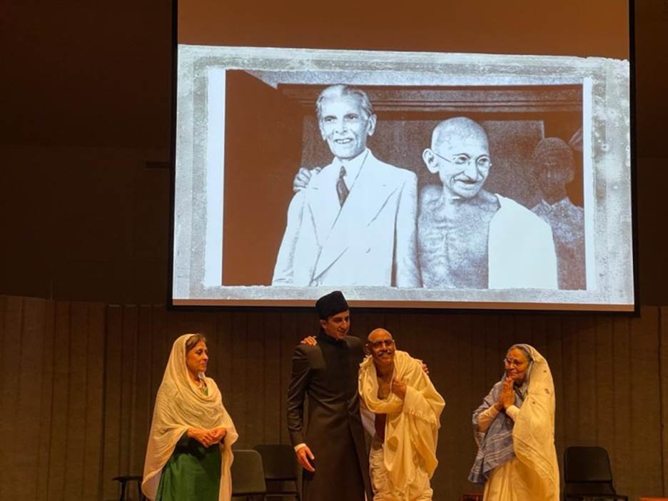 A group of people standing on a stage Description automatically generated