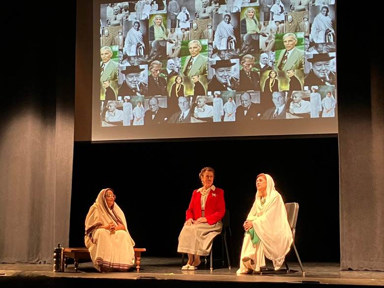 A group of women sitting on a stage Description automatically generated