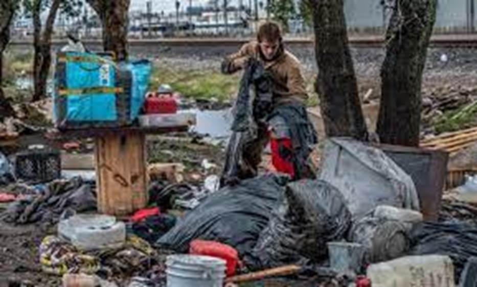 A picture containing text, outdoor, pile, trash Description automatically generated