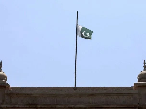 A flag on a pole Description automatically generated with low confidence