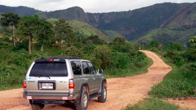 A car on a dirt road  Description automatically generated with medium confidence