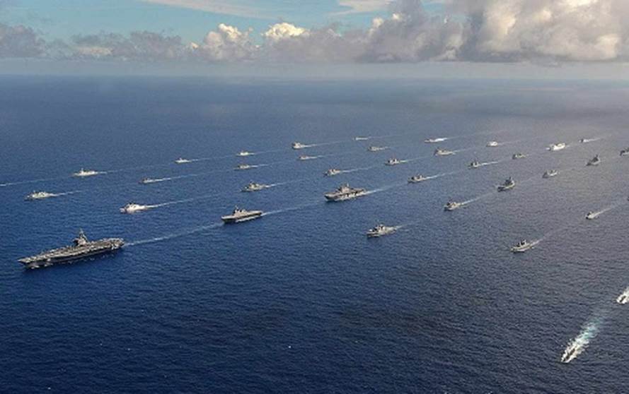 A group of boats in the ocean Description automatically generated with low confidence