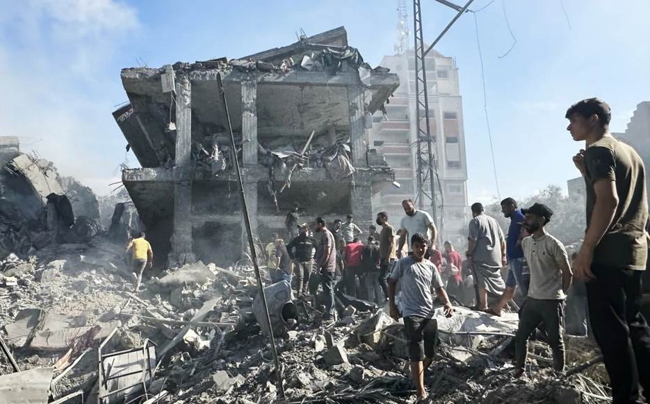 A view of a destroyed building following the Israeli airstrikes on a building at Al Bureij Refugee Camp in Deir al-Balah, Gaza