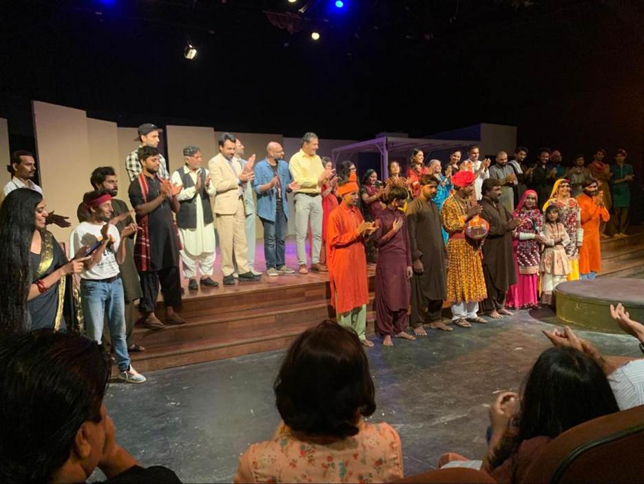 A group of people on a stage Description automatically generated