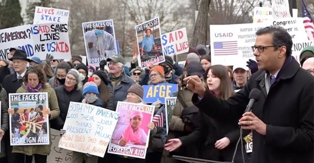 A group of people protesting  AI-generated content may be incorrect.