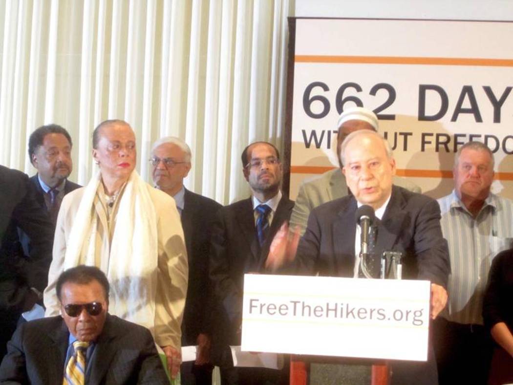 A group of people standing at a podium  AI-generated content may be incorrect.