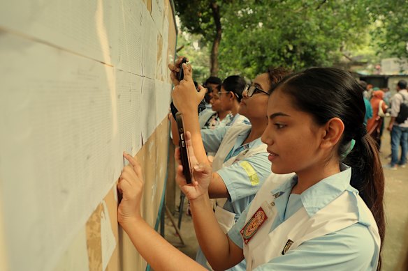 Students in Dhaka check their HSC results in October. Most children finish primary school in Bangladesh; there are more girls than boys in high school; and the share of women in paid work has risen from 5 per cent half a century ago to more than a third today, according to The Economist.