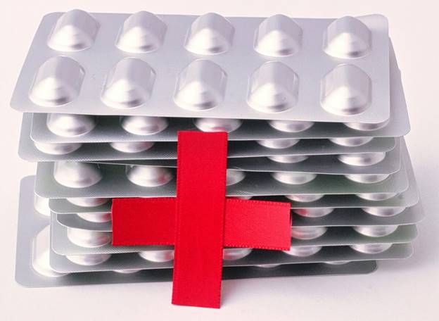A stack of pills with a red cross  AI-generated content may be incorrect.
