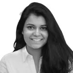 A person with long hair smiling  AI-generated content may be incorrect.