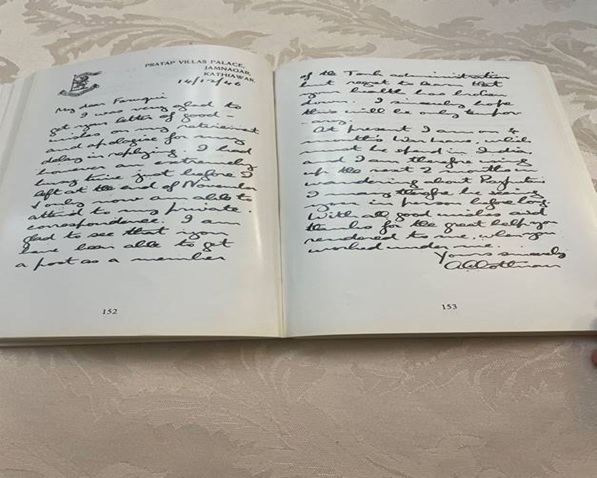 A hand holding a book  AI-generated content may be incorrect.