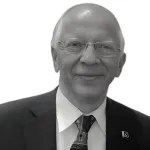 A person in a suit and tie  AI-generated content may be incorrect.