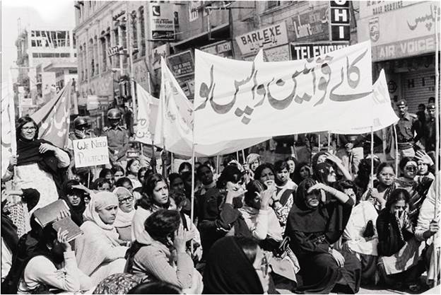 A group of people protesting in the street  AI-generated content may be incorrect.