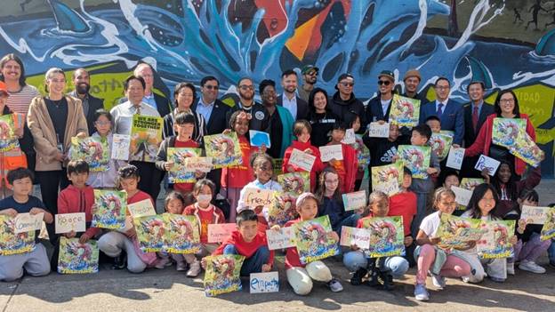 A group of people holding signs  AI-generated content may be incorrect.