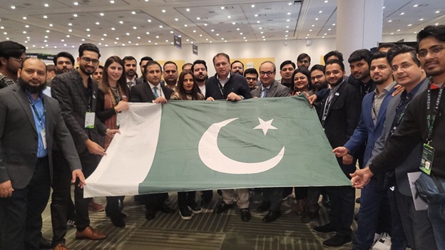 A group of people holding a flag  AI-generated content may be incorrect.