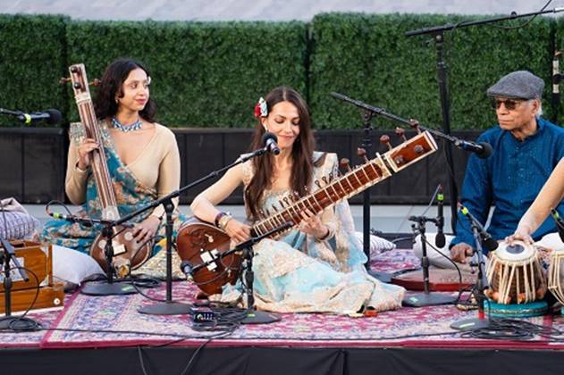 A group of people playing instruments AI-generated content may be incorrect.